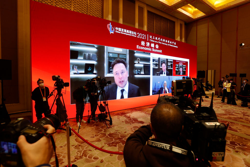 BEIJING, CHINA - MARCH 20: A screen shows Tesla CEO Elon Mask speaking via video link during the 2021 China Development Forum at Diaoyutai State Guesthouse on March 20, 2021 in Beijing, China. (Photo by Han Haidan/China News Service via Getty Images)