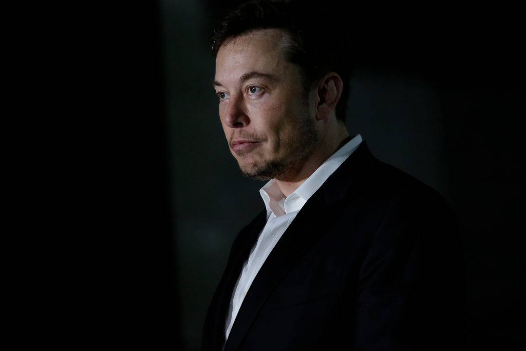 CHICAGO, IL - JUNE 14: Engineer and tech entrepreneur Elon Musk of The Boring Company listens as Chicago Mayor Rahm Emanuel talks about constructing a high speed transit tunnel at Block 37 during a news conference on June 14, 2018 in Chicago, Illinois. Musk said he could create a 16-passenger vehicle to operate on a high-speed rail system that could get travelers to and from downtown Chicago and O'hare International Airport under twenty minutes, at speeds of over 100 miles per hour. (Photo by Joshua Lott/Getty Images)