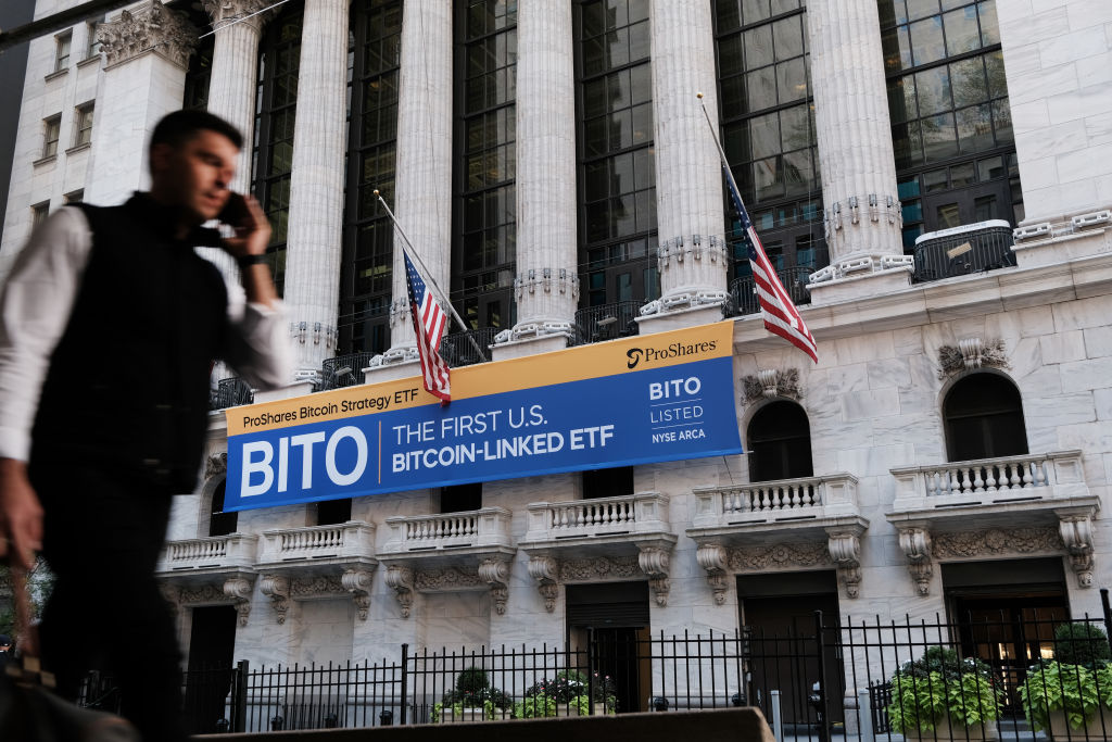 NEW YORK, NEW YORK - OCTOBER 19: A banner for the newly listed ProShares Bitcoin Strategy ETF hangs outside the New York Stock Exchange (NYSE) on October 19, 2021 in New York City. Trading under the ticker ‘BITO, the first Bitcoin-linked exchange-traded fund in the U.S rose 3% when trading began and last traded 2.3% higher at $40.94.  (Photo by Spencer Platt/Getty Images)
