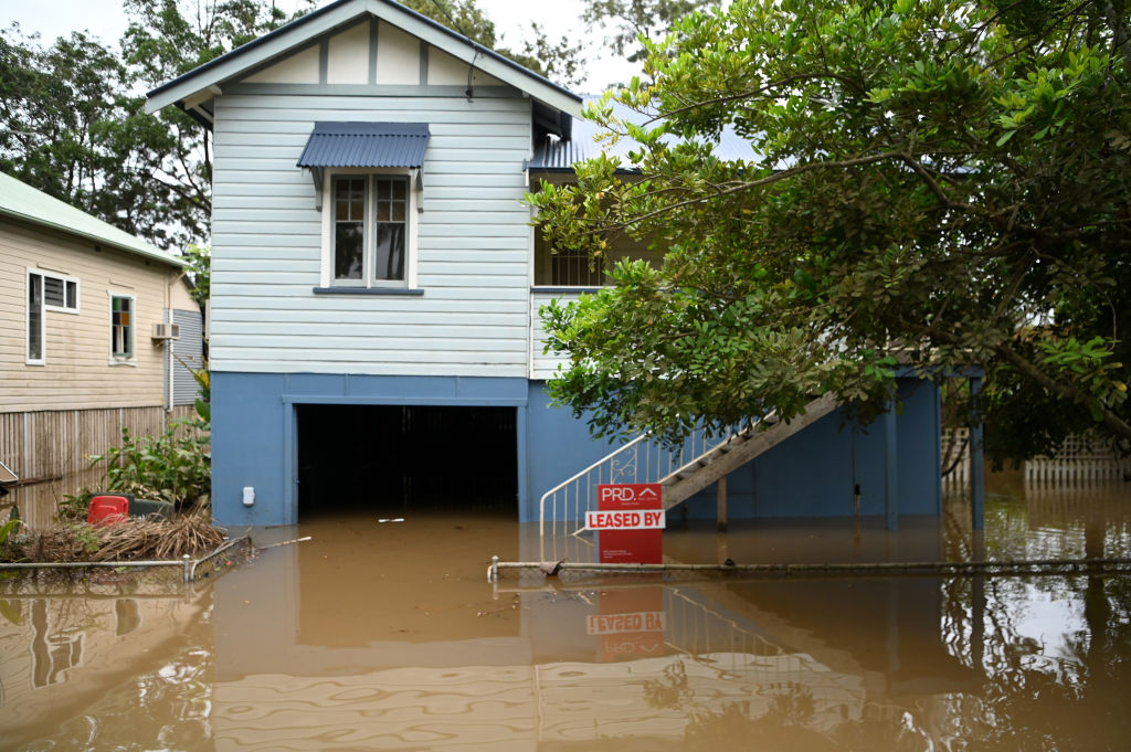 LISMORE, AUSTRALIA - MARCH 31: A house is surrounded by floodwater on March 31, 2022 in Lismore, Australia. Evacuation orders have been issued for towns across the NSW Northern Rivers region, with flash flooding expected as heavy rainfall continues. It is the second major flood event for the region this month. (Photo by Dan Peled/Getty Images)