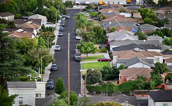 A view of houses in a neighborhood in Los Angeles, California, on July 5, 2022. - While two years of a booming US housing market brought wealth to many, a shortage of housing is making home ownership unaffordable for millions of Americans with prices up more than 30% over the past few years and interest rates rising. (Photo by Frederic J. BROWN / AFP) (Photo by FREDERIC J. BROWN/AFP via Getty Images)
