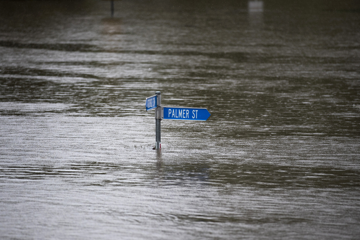 A street sign submerged by floodwaters in Windsor, New South Wales. Photographer: Brent Lewin/Bloomberg
