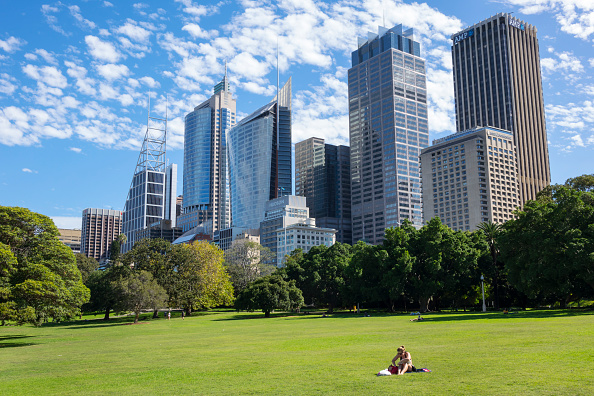 Australia, Sydney, Royal Botanic Gardens CBD Central Business District city skyline skyscrapers woman lawn park. (Photo by: Jeff Greenberg/Universal Images Group via Getty Images)
