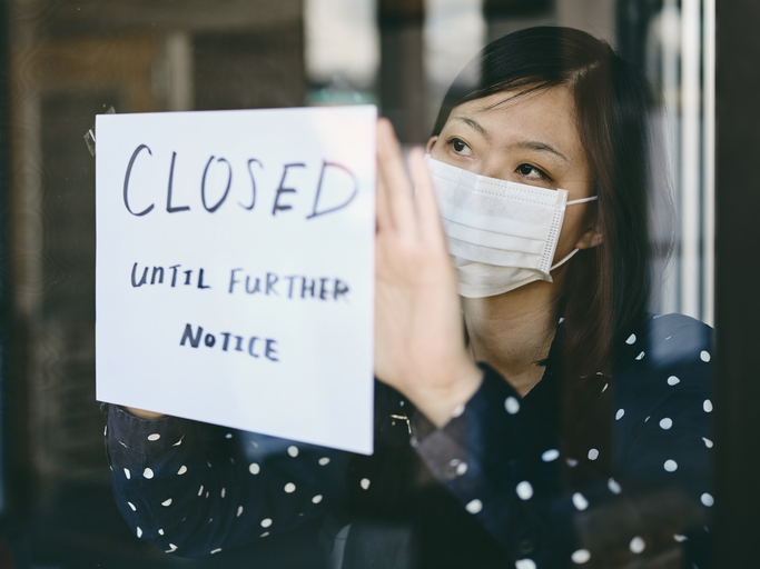 An Asian woman small business owner affected by the COVID-19 virus.