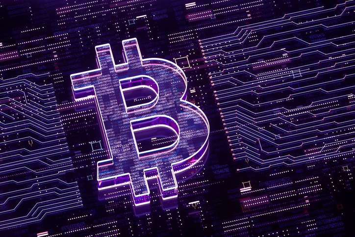 Digital generated image of bitcoin sign  over glowing digital circuit board.