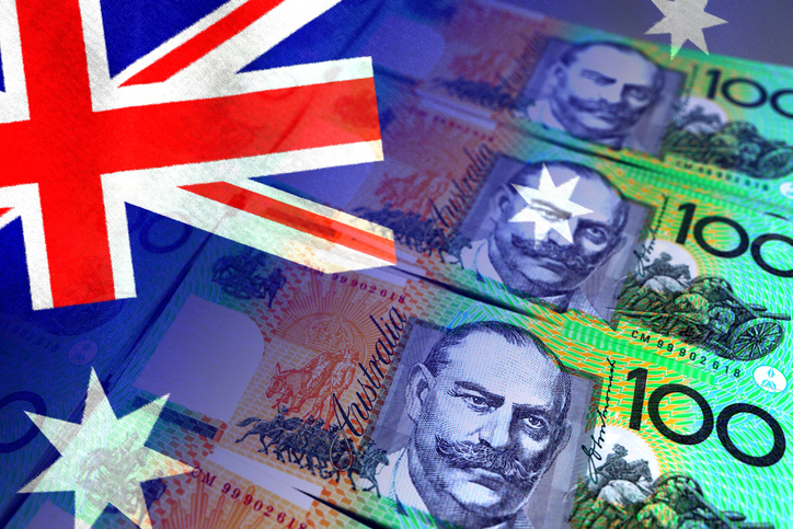 Australia flag and Australian dollar cash bills (money, economy, business, finance, inflation, crisis)