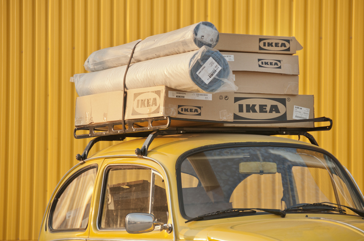 Izmir, Turkey - February 23, 2008: Group of boxes of furnitures installed at the top of an old fashioned VW car and bought from Ikea which is a Swedish company that designs and sells ready-to-assemble furniture (such as beds, chairs and desks), appliances and home accessories.  Image has been captured in front of Forum Bornova Ikea Market in Bornova, Izmir.