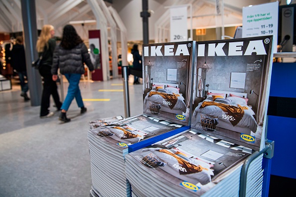 Catalogues are placed for people to take at the entrance to one of the stores of the Swedish furniture giant Ikea on December 7, 2020 in Jarfalla, near Stockholm. - Swedish furniture giant Ikea said Monday, December 7, 2020 it would stop printing its famed physical catalogue, printed yearly in tens of millions of copies, after 70 years, as customers move to digital alternatives. (Photo by Jonathan NACKSTRAND / AFP) (Photo by JONATHAN NACKSTRAND/AFP via Getty Images)