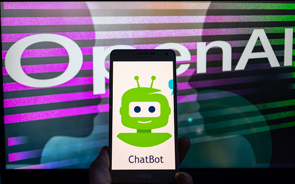 OpenAI logo seen on screen with ChatGPT website displayed on mobile seen in this illustration, on January 8, 2023 in Brussels, Belgium. (Photo illustration by Jonathan Raa/NurPhoto via Getty Images)
