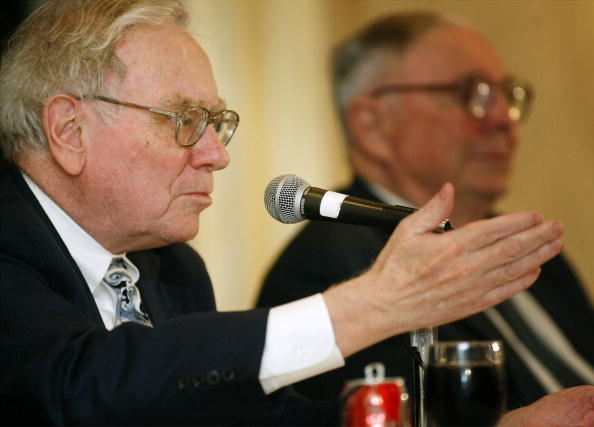 OMAHA, NE - MAY 4:  Berkshire Hathaway's CEO Warren Buffett (L) and his business partner Vice Chairman Charles Munger answer questions at a news conference May 4, 2003 in Omaha, Nebraska. Buffett attended the Berkshire Hathaway 2003 annual shareholders' meeting May 3, where he spoke about excessive executive salaries, the company's record first-quarter earnings of $1.7 billion, and announced that there are four possible candidates to succeed him when he leaves.  (Photo by Eric Francis/Getty Images)