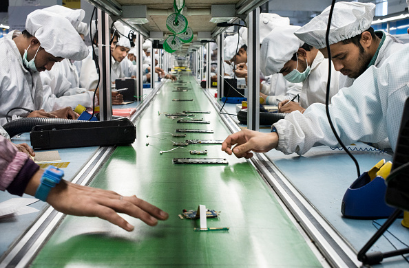INTEX TECHNOLOGIES FACTORY, NOIDA, UTTAR PRADESH, INDIA - 2016/02/10: Workers assemble smartphones on the production line inside the Intex Technologies brand plant in Noida.
Intex Technologies is a Smartphone manufacturer in India and it employs over 3000 technicians for its mobile phone assemble operations in 2017. (Photo by Miguel Candela/SOPA Images/LightRocket via Getty Images)