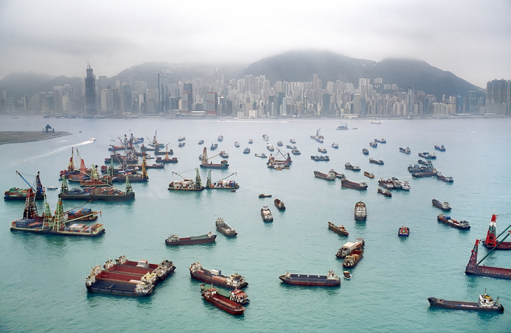 Hong Kong Harbour with freight container ships waiting for cargo. Image: Getty
