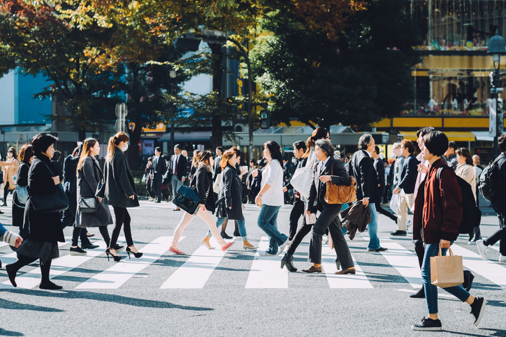Crowd of busy commuters crossing street in Shibuya crossroad, Tokyo. Image: Getty