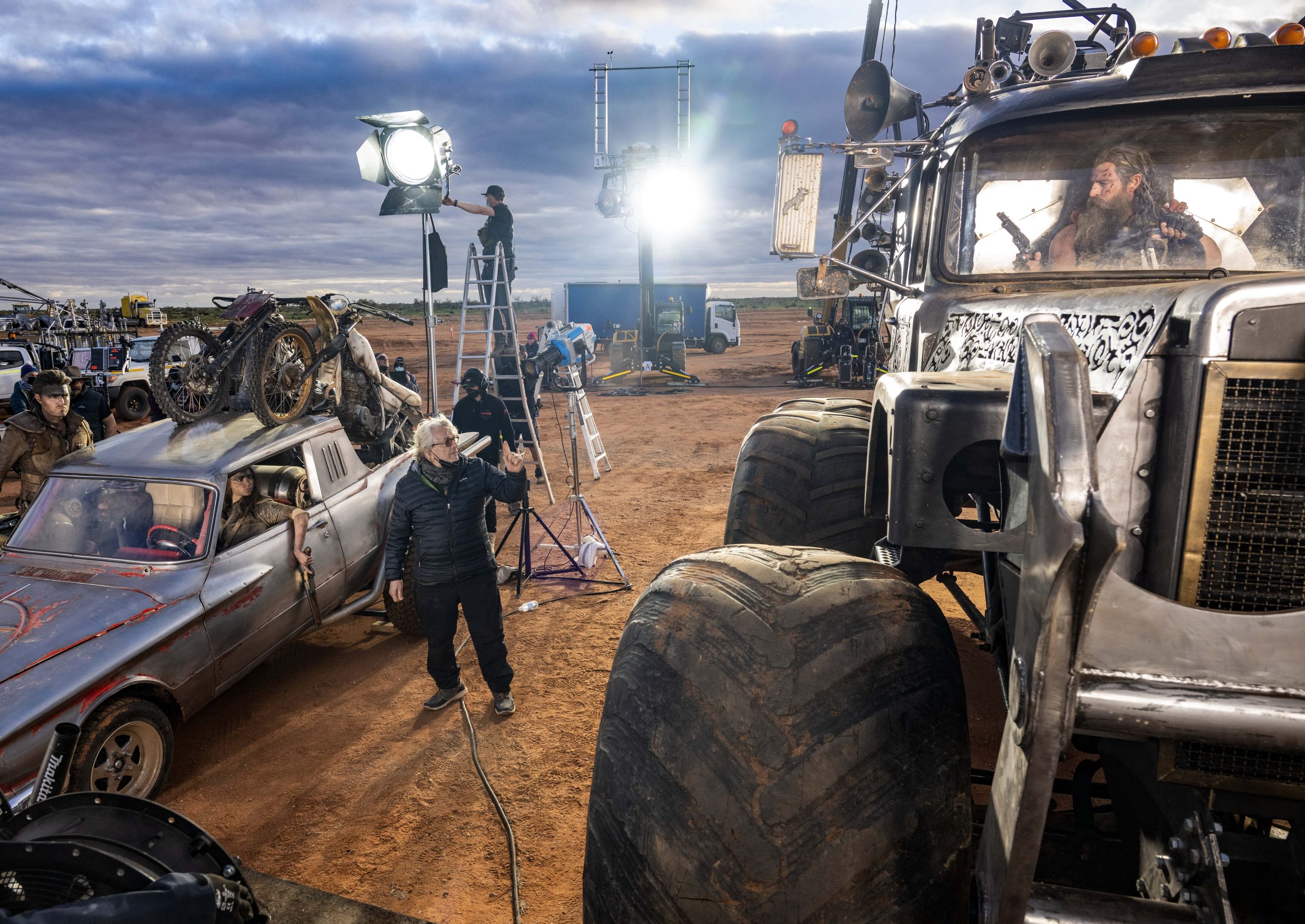 Director George Miller on the set of Furiosa: A Mad Max Saga with Chris Hemsworth filmed at Broken Hill. Image courtesy of Warner Bros