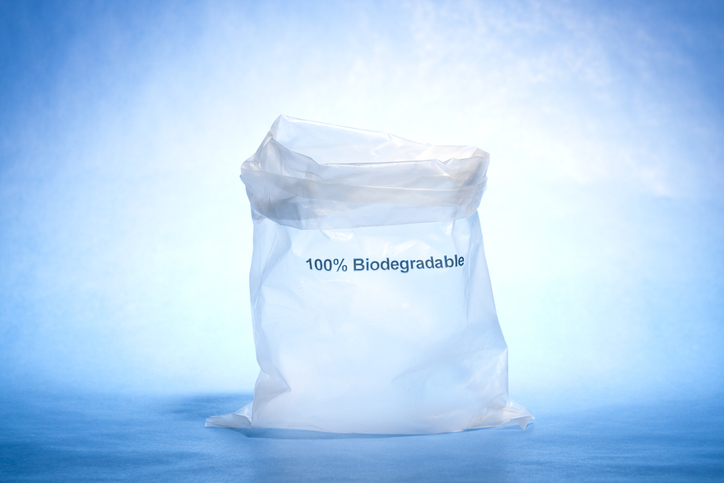 Biodegradable plastic bag on blue. Another view: