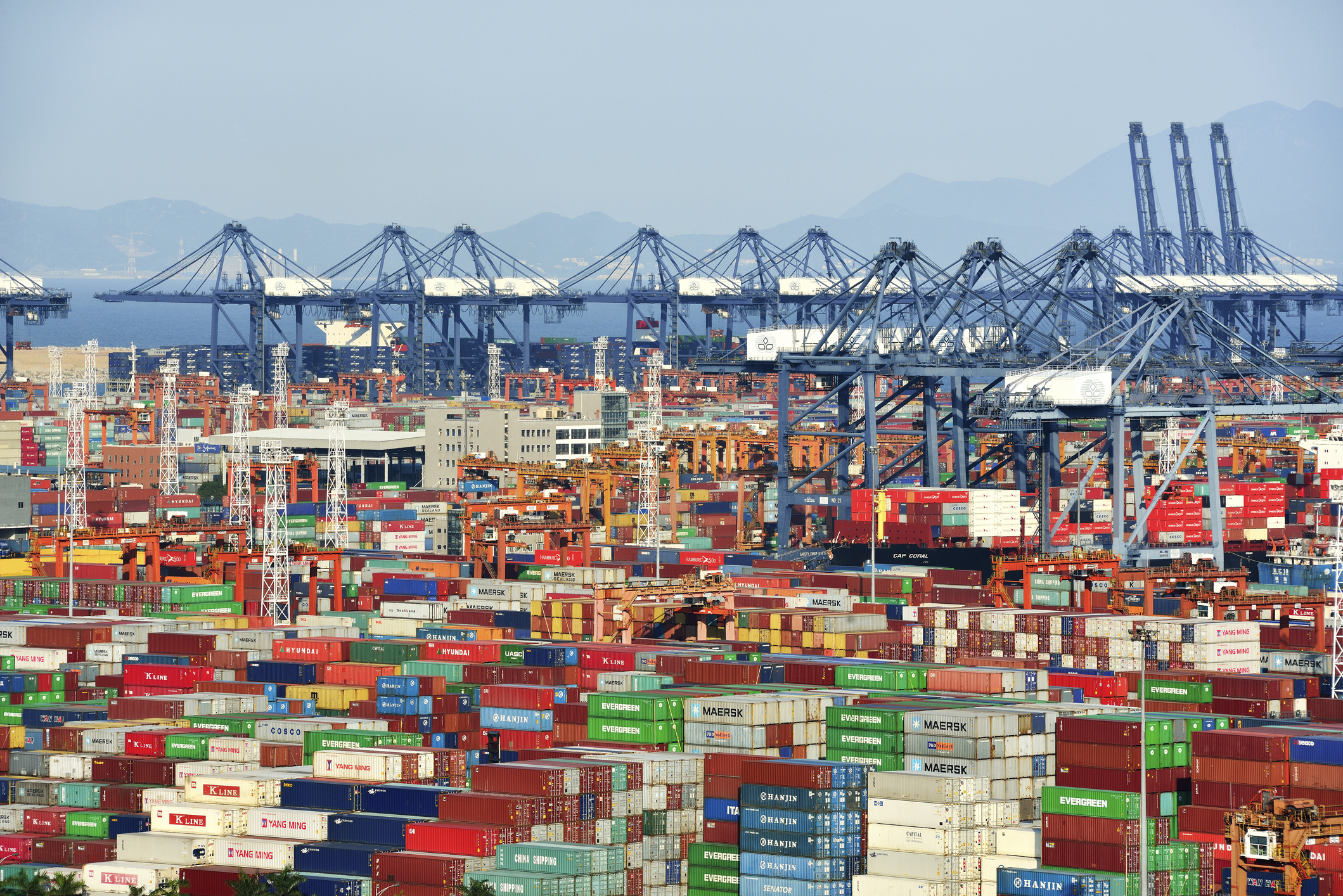 Containers and cranes in harbor, Shenzhen, China.