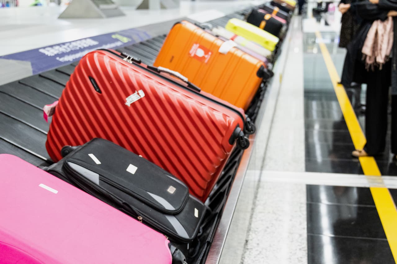 It’s getting more expensive to travel with a bag this year. DREAMSTIME