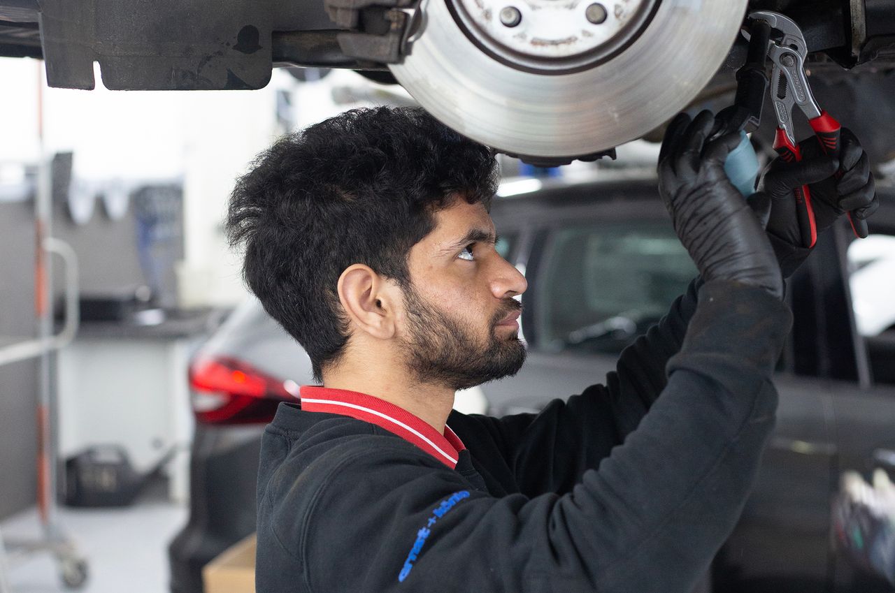 Ankush Kankar, a migrant from India, working as an apprentice auto mechanic in Freiburg, Germany. BAPTISTE SCHMITT FOR THE WALL STREET JOURNAL
