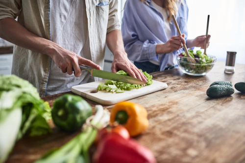 Australians are cutting back on dining out in favour of cooking at home to save money. Image: Shutterstock