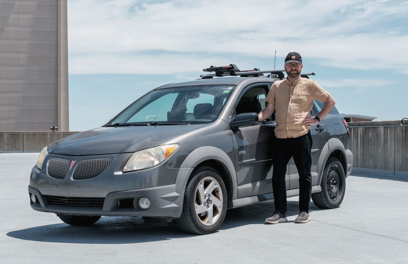 Ryan Felton and his 2005 Pontiac Vibe. Photo: Patrick George for WSJ.
